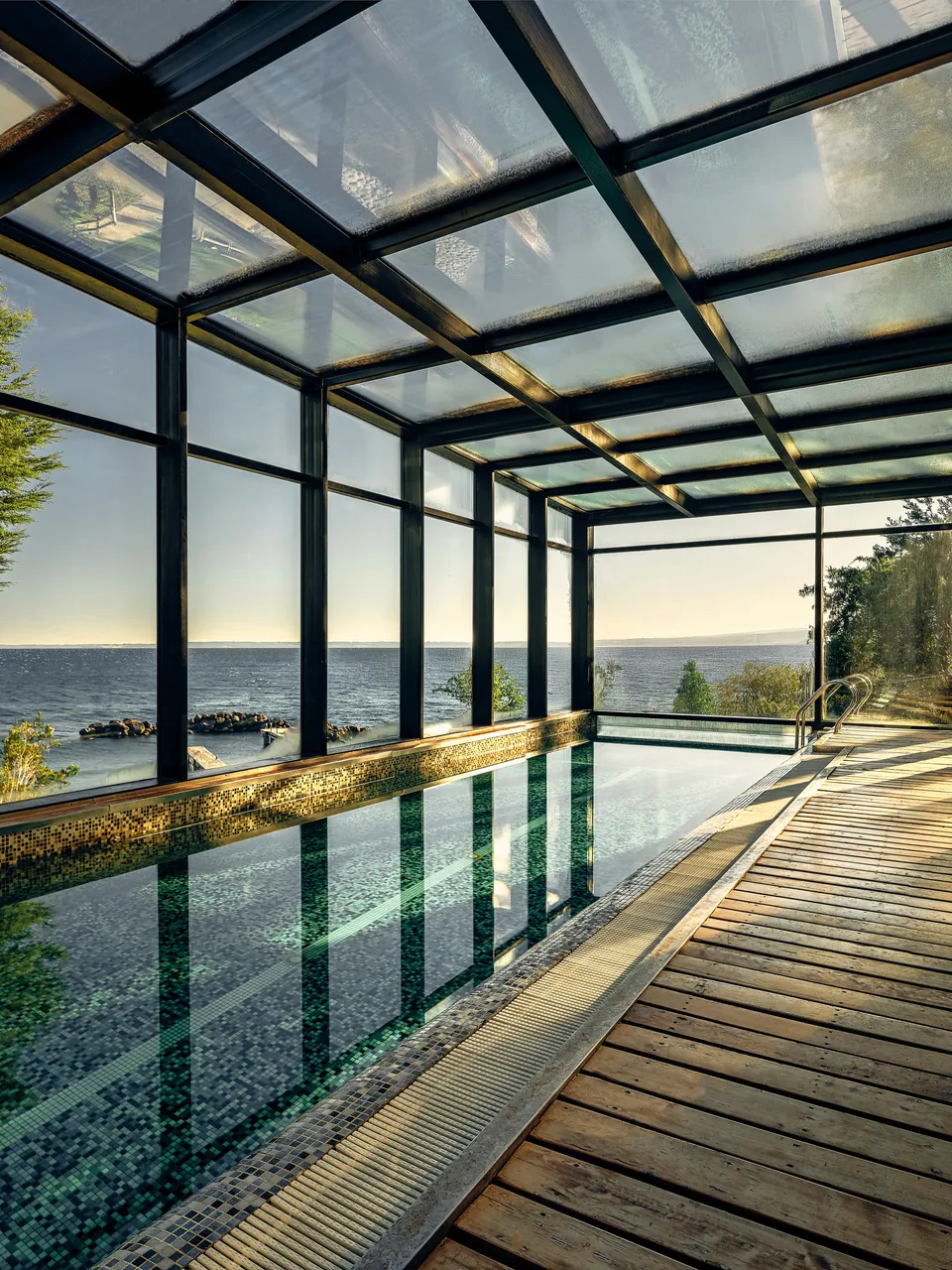 Glass-roofed indoor pool overlooking the lake