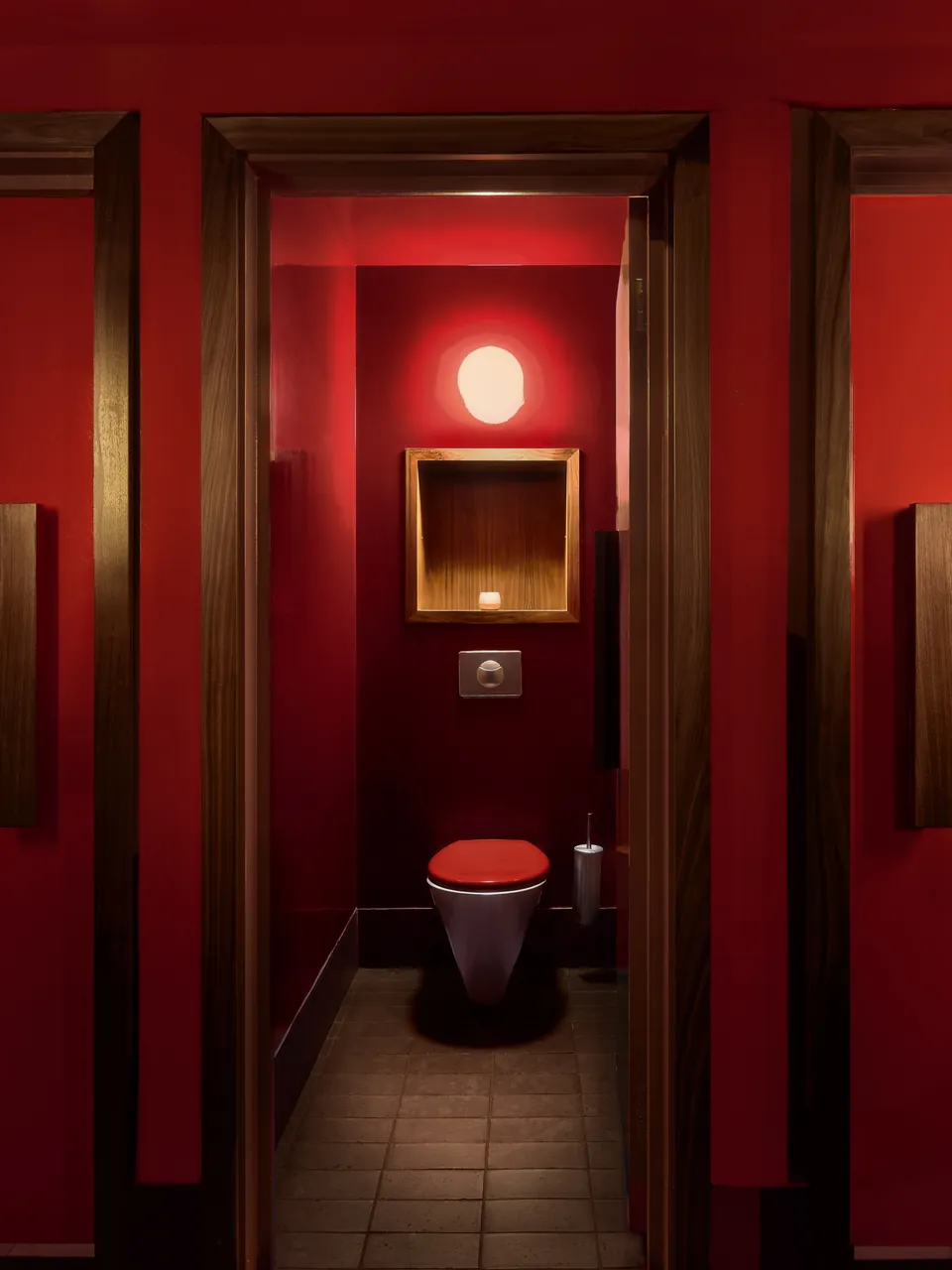 Red lacquered washroom seen through a doorway