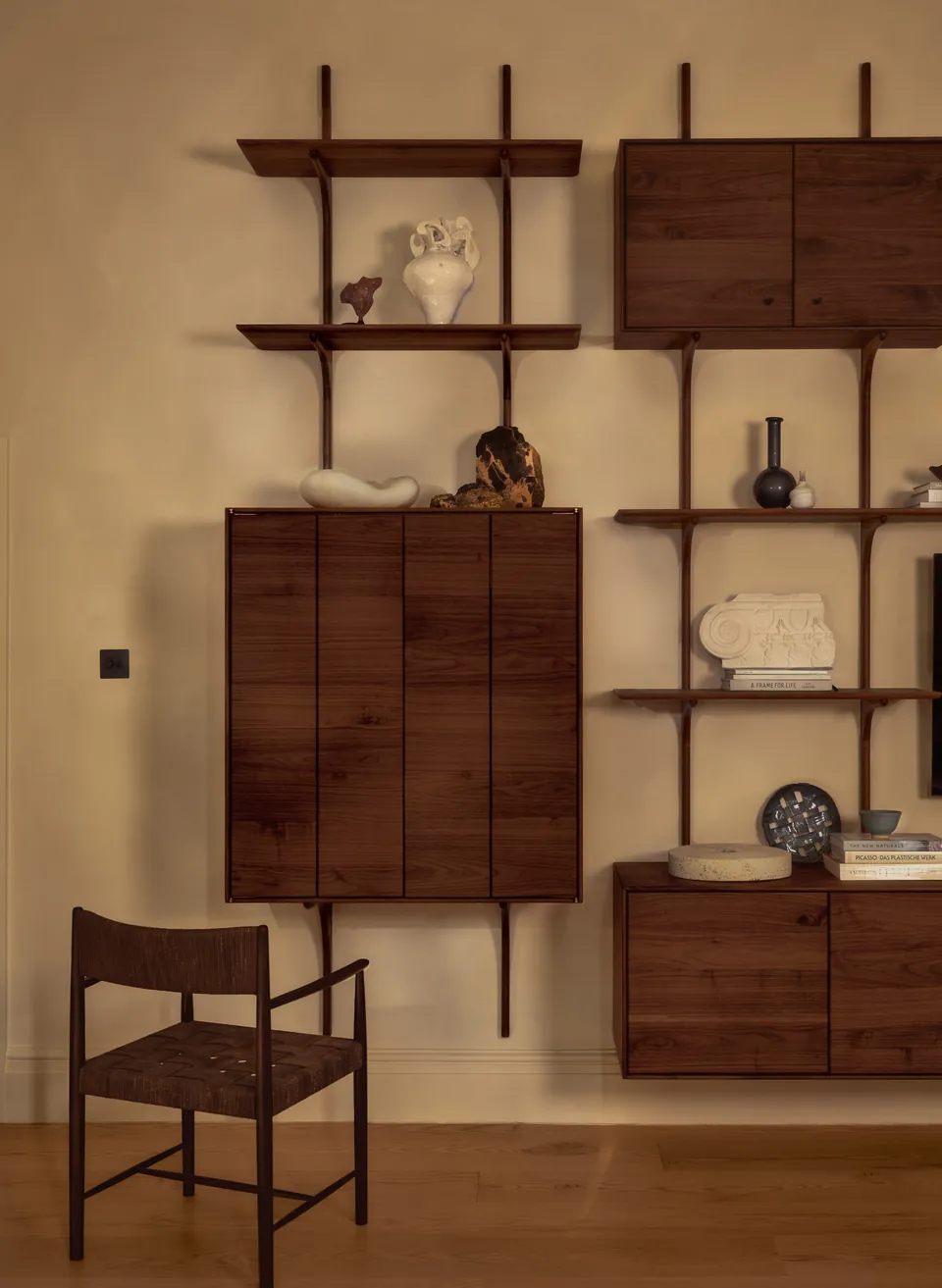 Walnut cabinet closed among the shelves