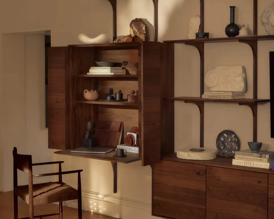 Walnut cabinet open on a writing desk