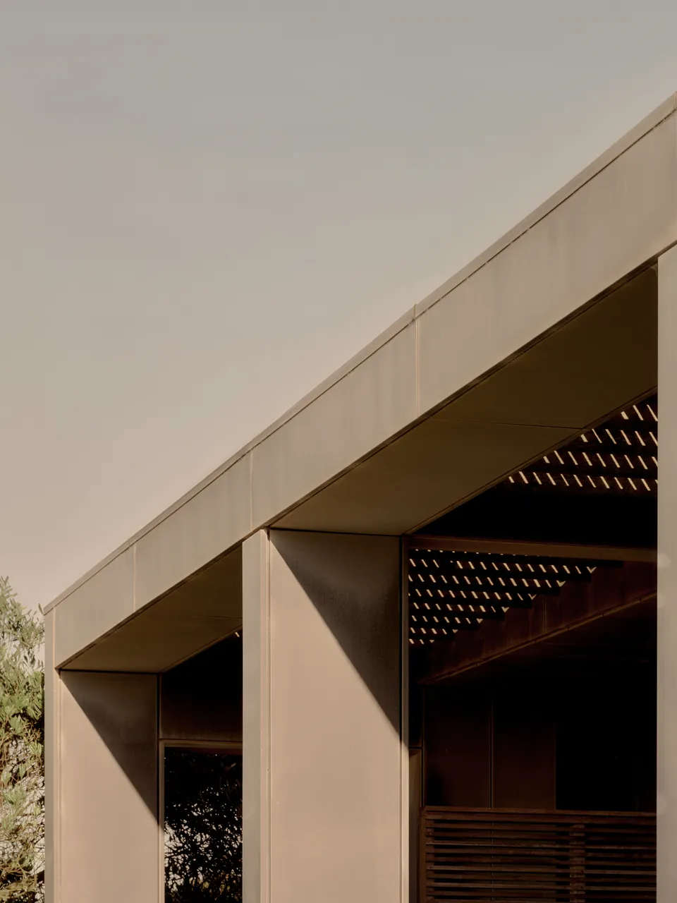 The edge of a pale roof against the evening sky